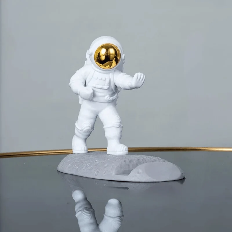 Support téléphone bureau astronaute