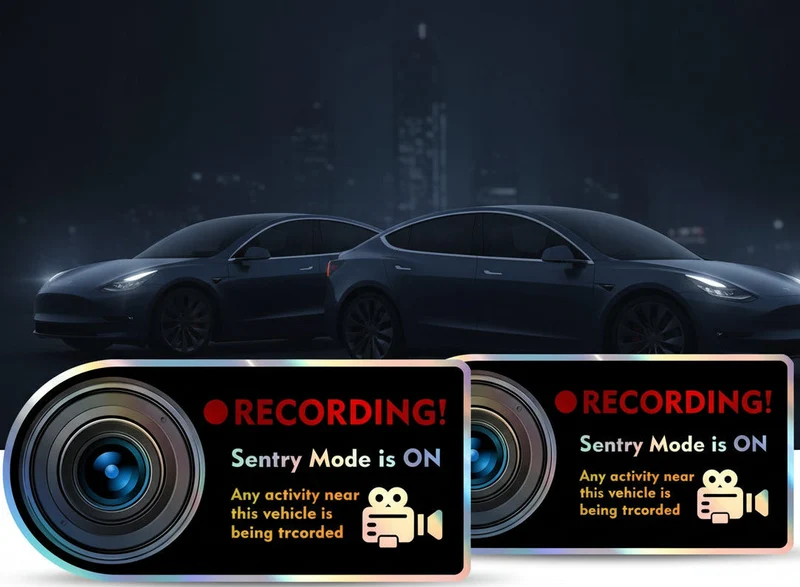 4 autocollants noirs pour l'enregistrement vidéo en mode Sentinelle, avec une étiquette rouge indiquant « Caméra ! Mode Sentinelle activé ». Autocollants amovibles pour votre Tesla.